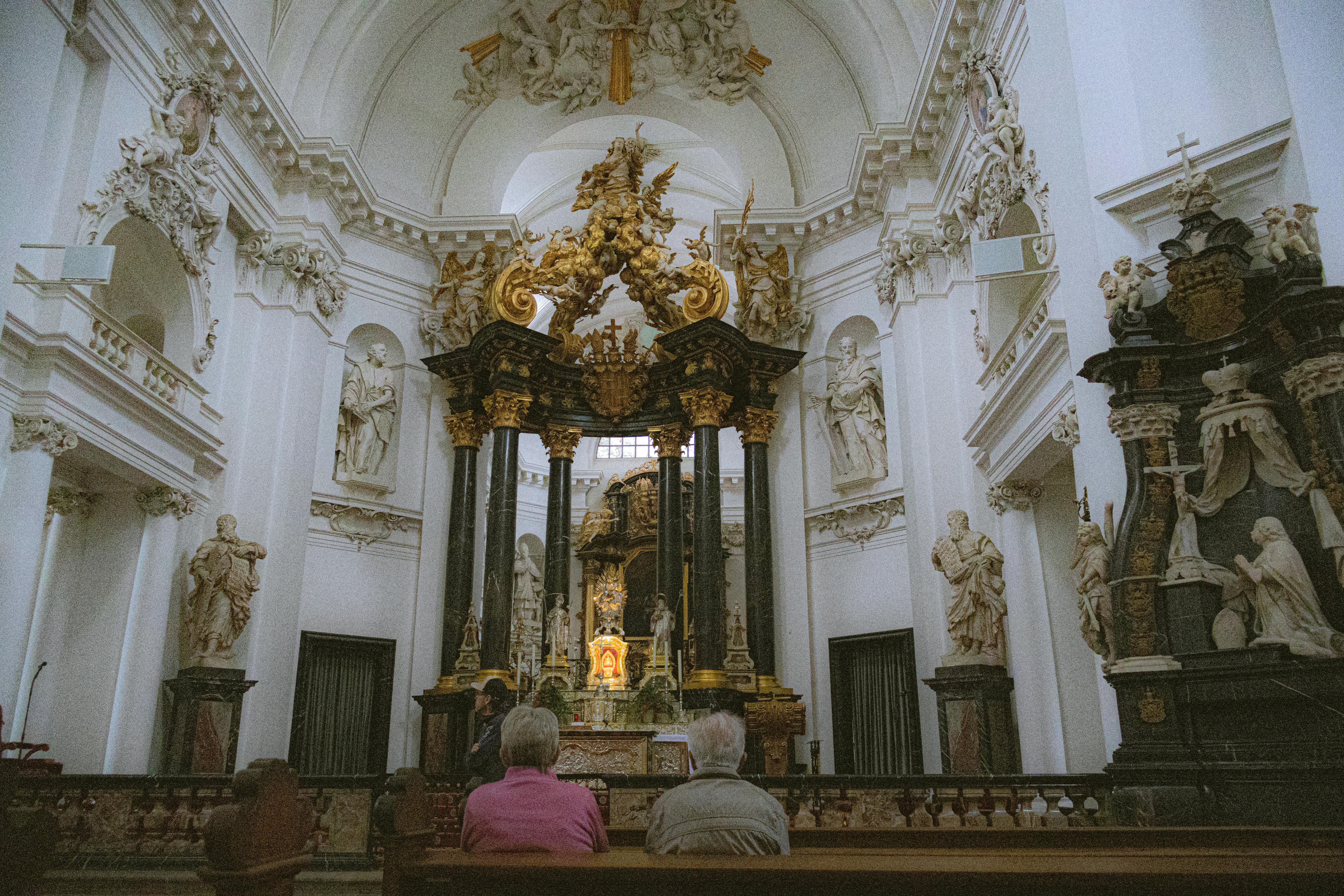 people sitting in fulda cathedral