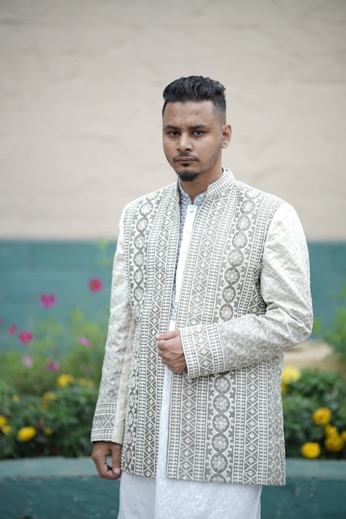 A man in a white and grey jacket