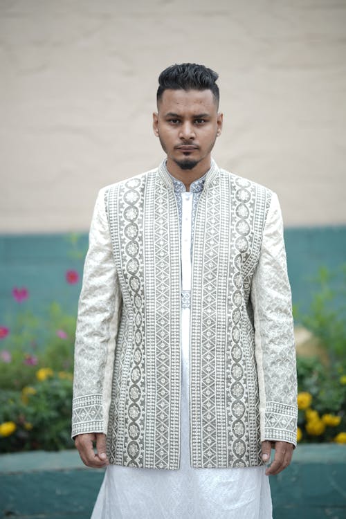 A man in a white and grey jacket