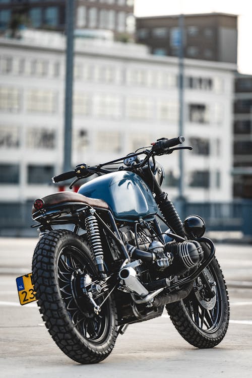 Free Selective Focus Photo of Parked Blue and Black Cafe Racer Motorcycle Stock Photo
