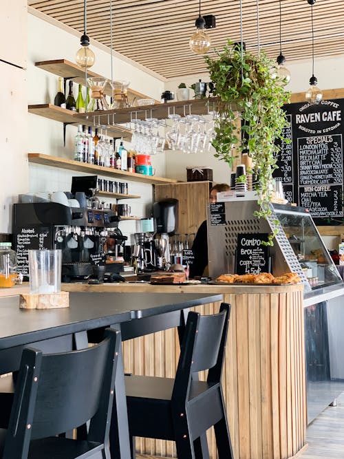 Free Black Wooden Dining Table In A Coffee Shop Stock Photo