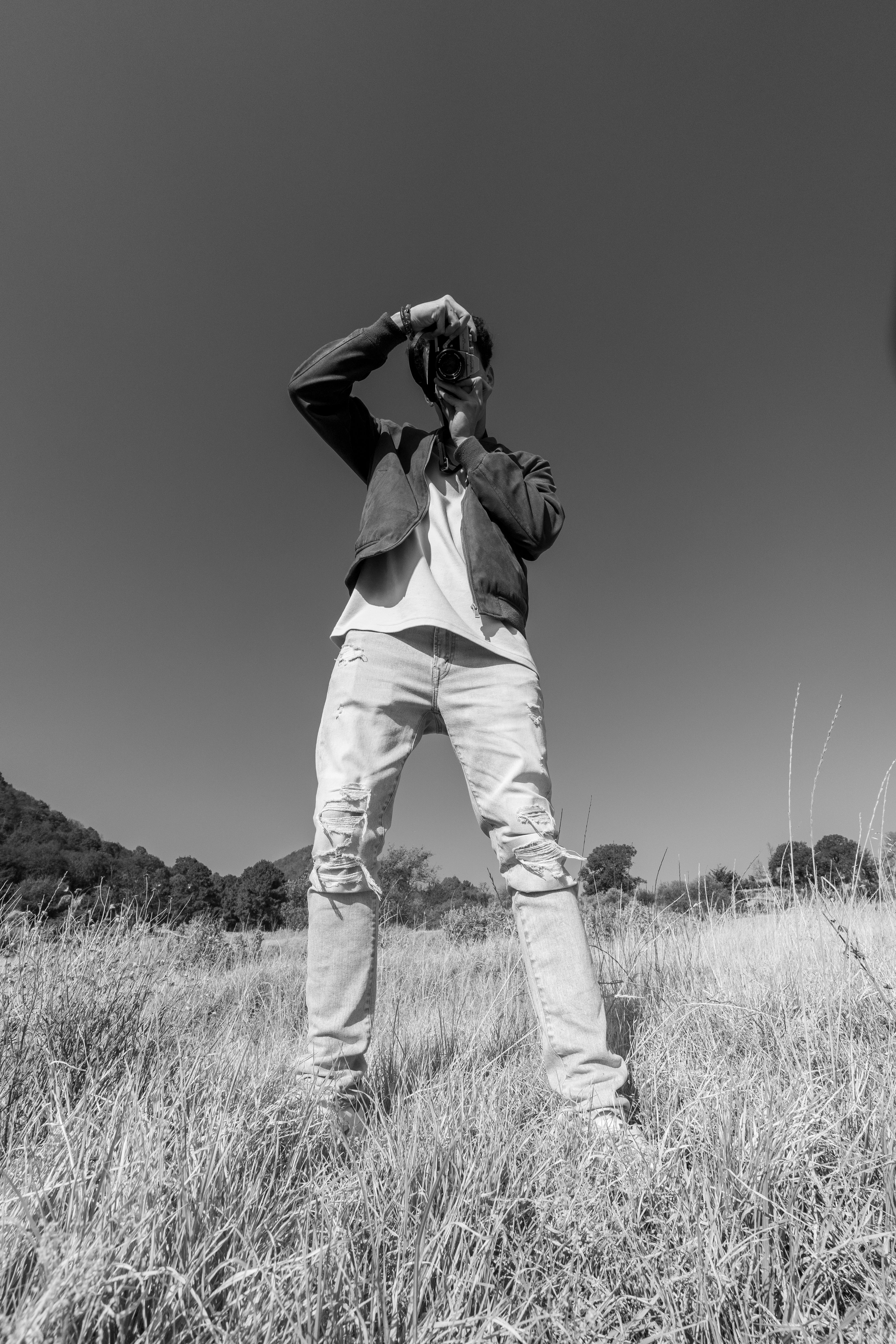photographer in countryside in black and white