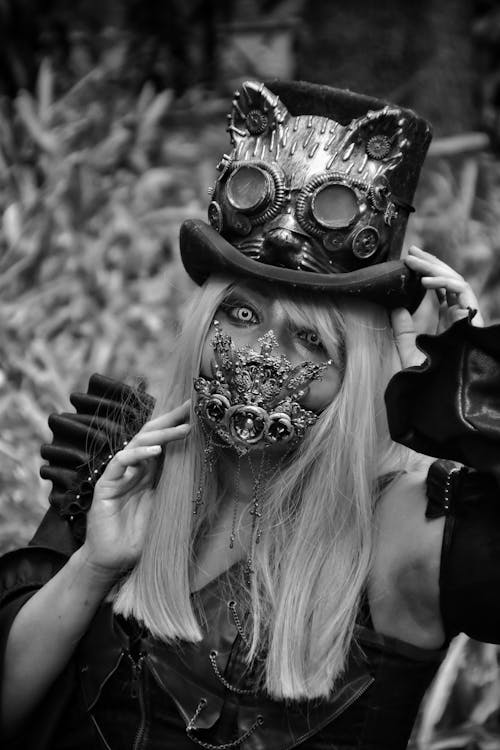 A woman in a steampunk costume with a mask