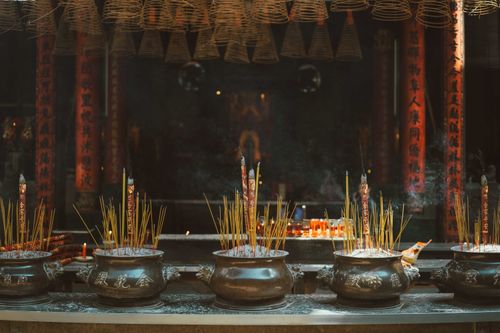 Free Traditional incense burning ritual at a temple in Ho Chi Minh City, Vietnam, evoking spirituality and culture. Stock Photo