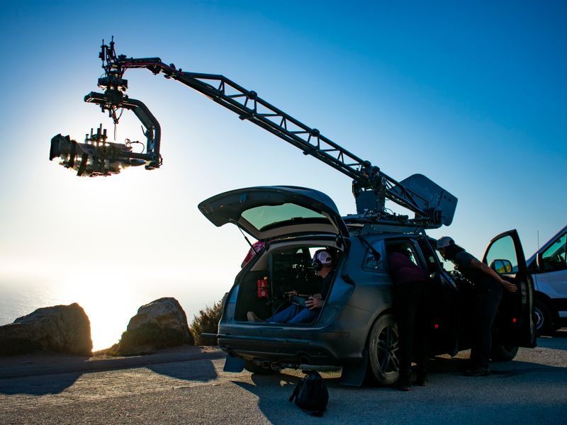 Film crew operating camera on location