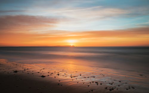 Безкоштовне стокове фото на тему «берег, Захід сонця, море»