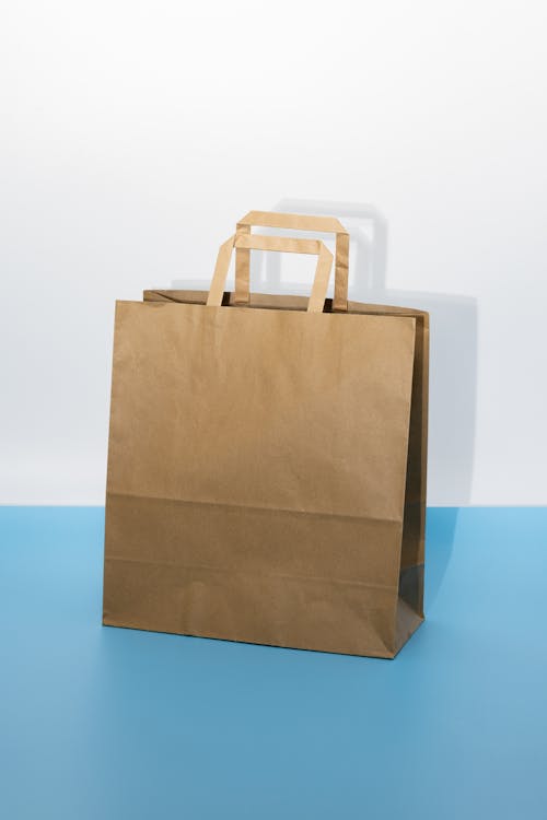 A brown paper bag on a blue background