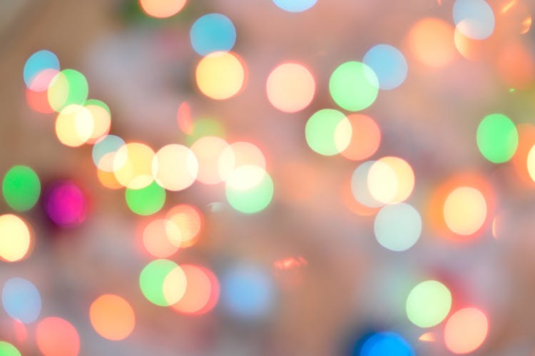 Defocused Image Of Illuminated Christmas Lights