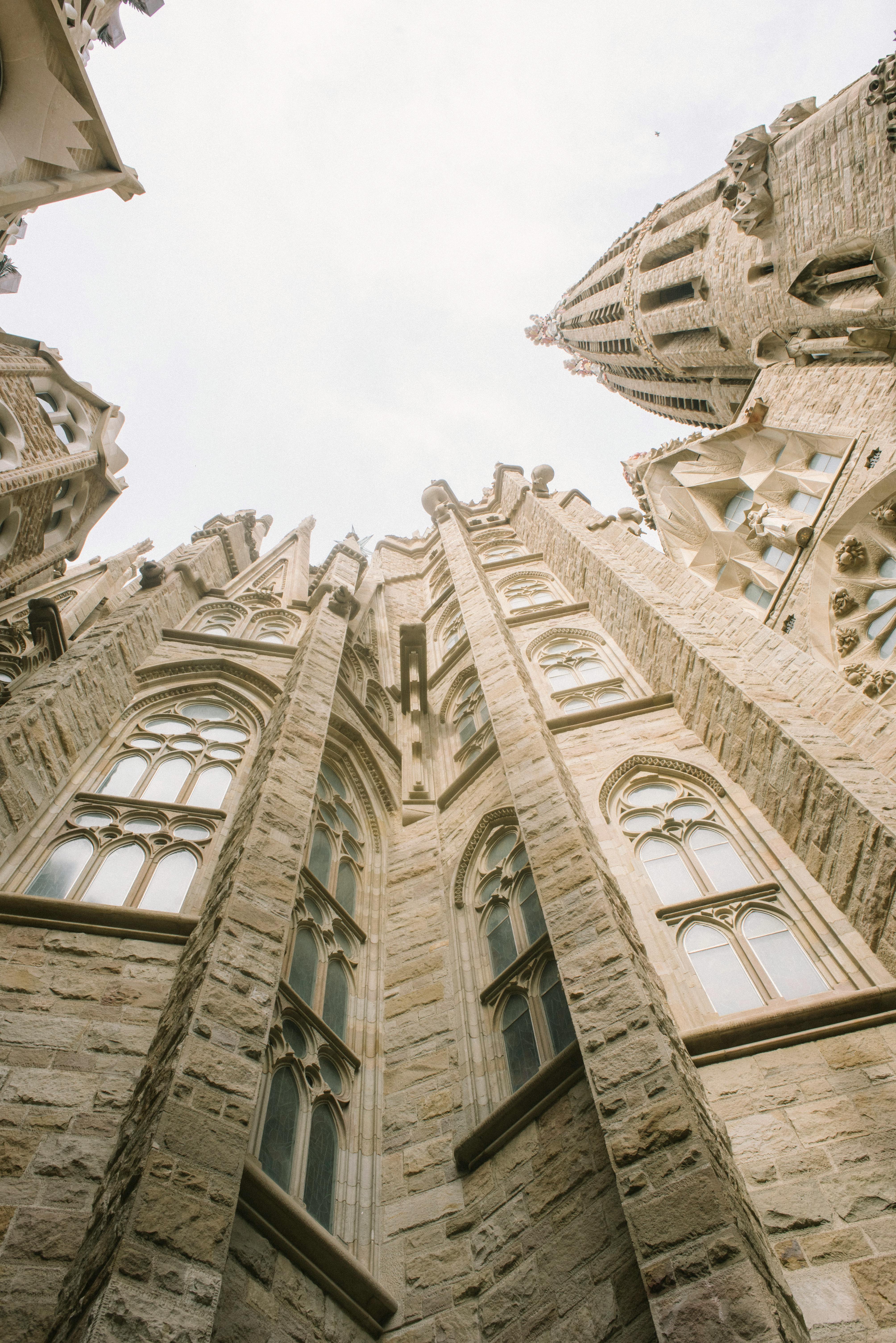 Low angle view of Sagrada Familia showcasing its stunning Gothic architecture.