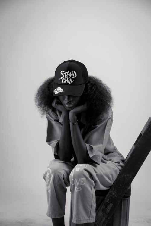 Free Stylish portrait of a woman in casual urban fashion with a cap. Stock Photo