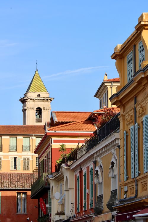 Free Colorful Mediterranean architecture with vibrant facades under a clear blue sky. Stock Photo