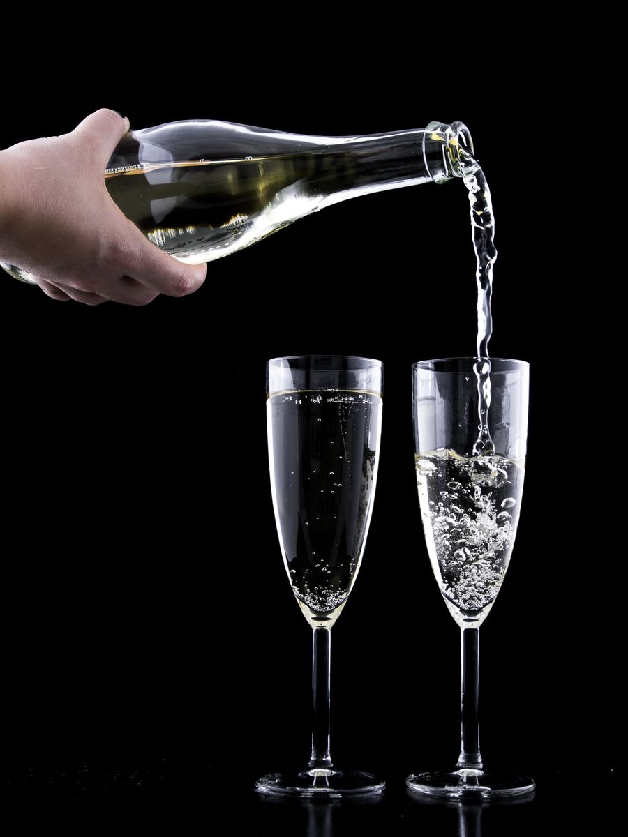 Golden Champagne poured into two flutes