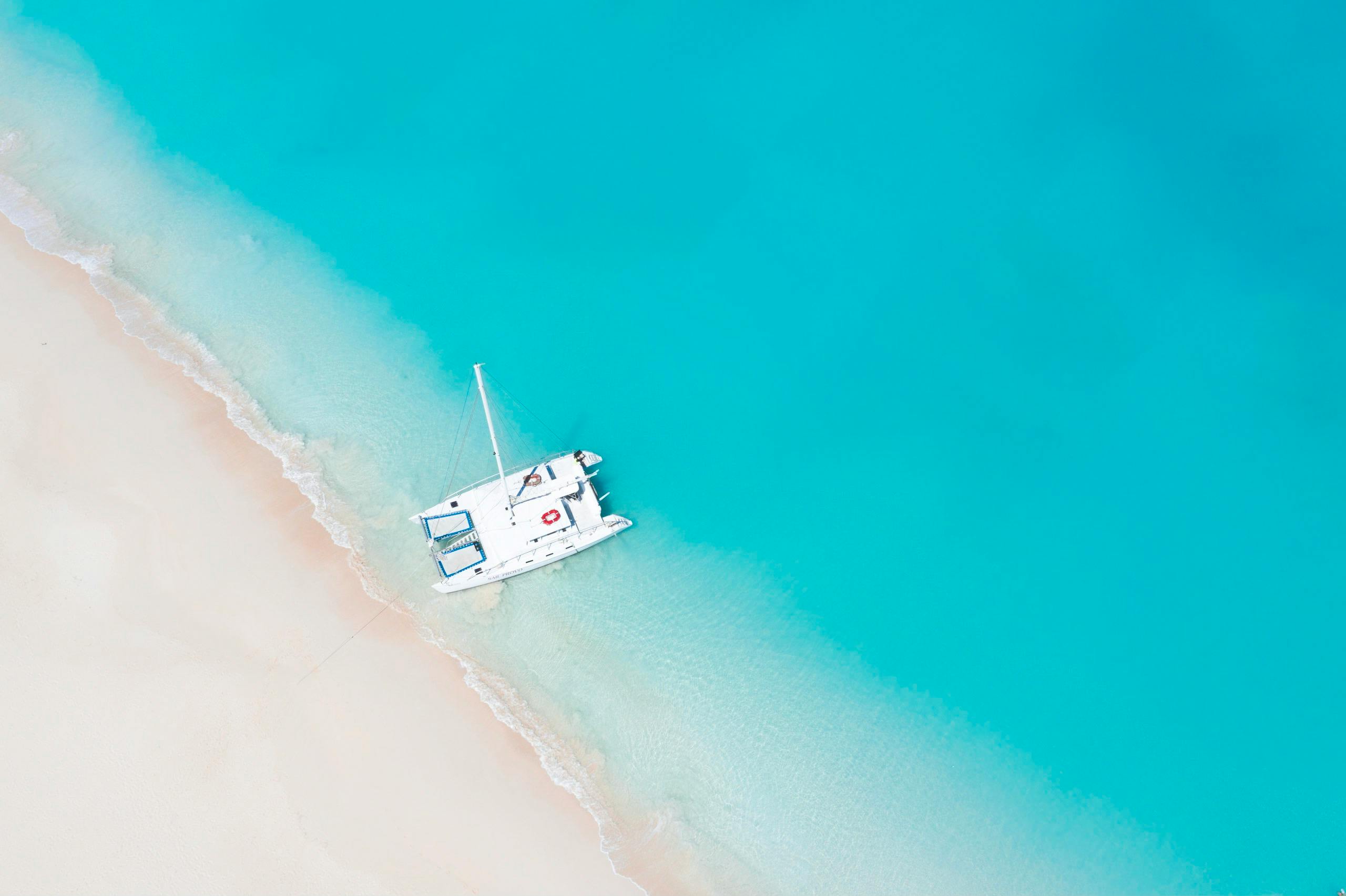 Top View Photo of Boat On Seashore