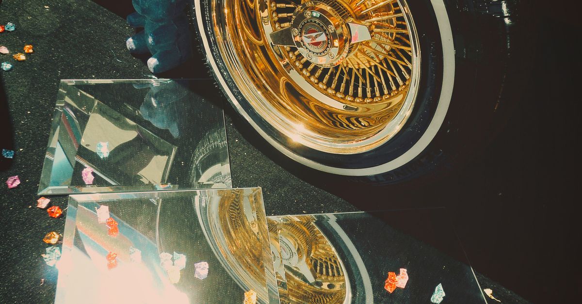 Golden Rim Image Close-up of a Wheel with a Golden Rim · Free Stock Photo