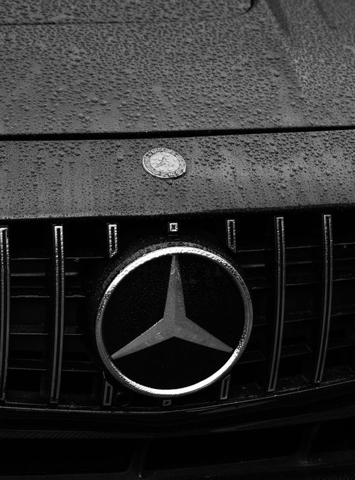 Free Black and white close-up of a luxury car emblem with rain droplets on the bonnet, Guelph, Canada. Stock Photo