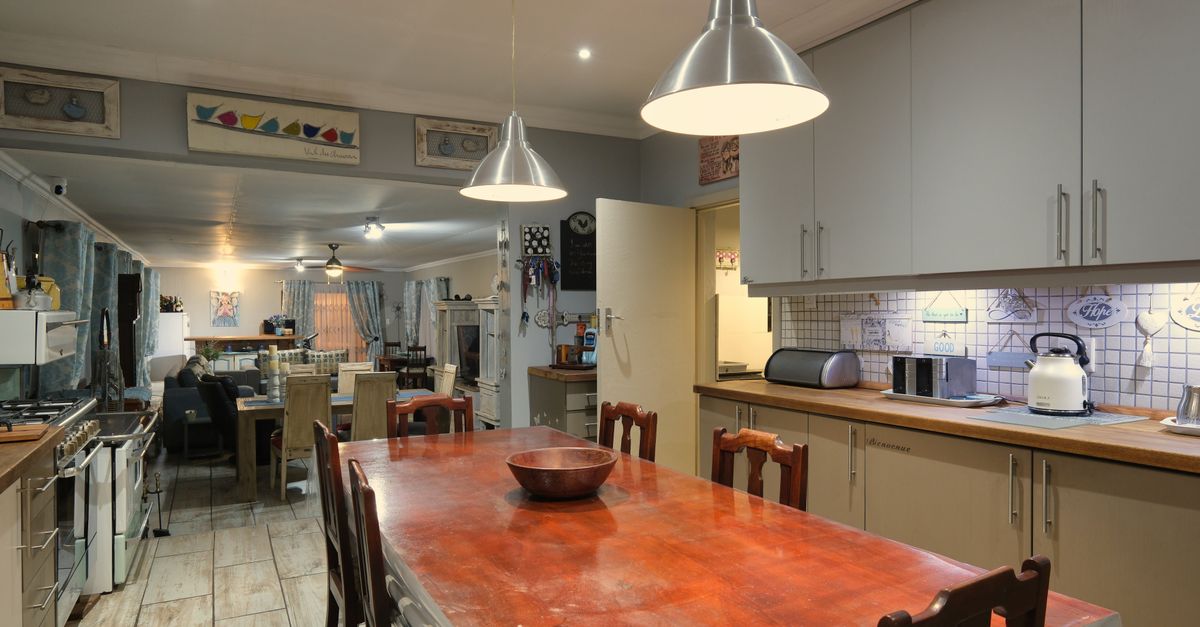 Middle Kitchen Work Table Interior of a Modern Kitchen with a Table in the Middle · Free Stock Photo