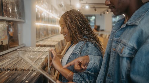Two people looking at records in a record store
