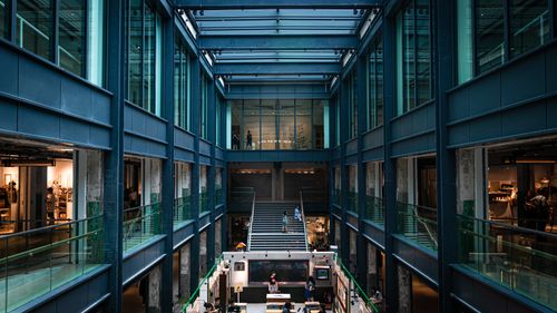 Free A high-tech atrium interior with glass and steel structures in Hong Kong's New Territories. Stock Photo