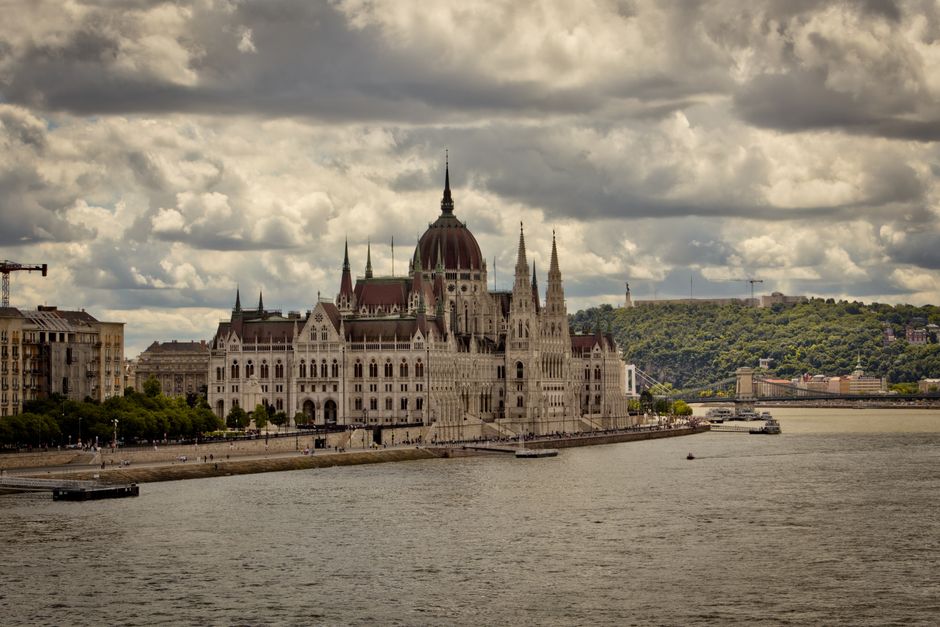 Scenic view of the Hungarian Parliament Building on a cloudy day in Budapest.