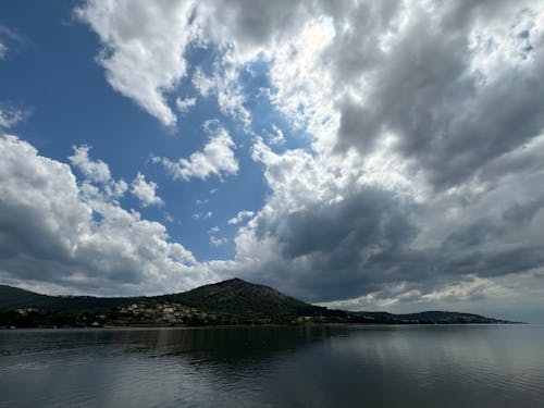 Clouds over the river Minho with a mountain in the background, Eiras, O Rosal, Galicia, Spain, May 2023