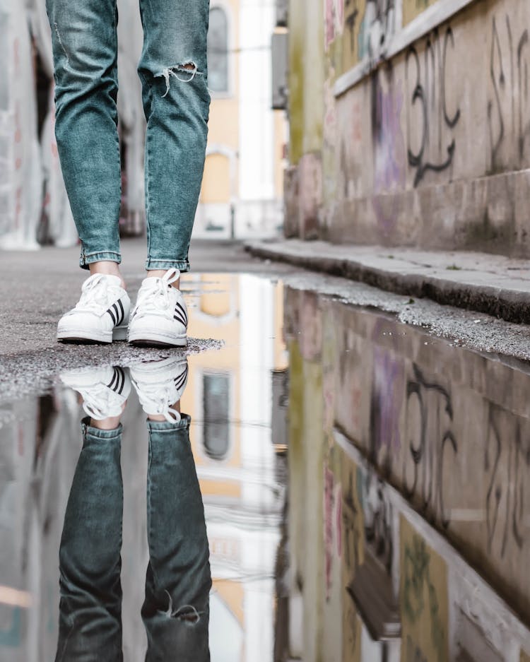 Person Wearing White-and-black Adidas Shoes