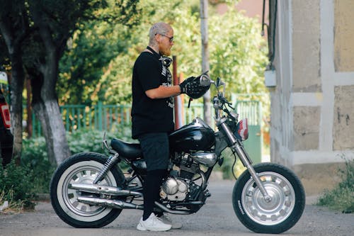 Free Man Riding Motorcycle Stock Photo