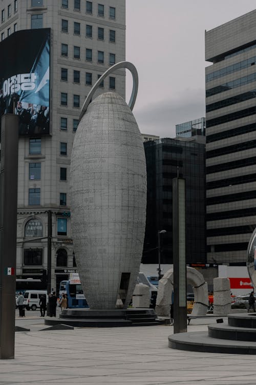 A large concrete sculpture in the middle of a city