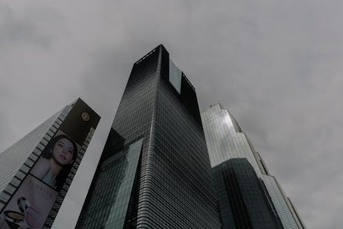 A picture of tall buildings with a cloudy sky