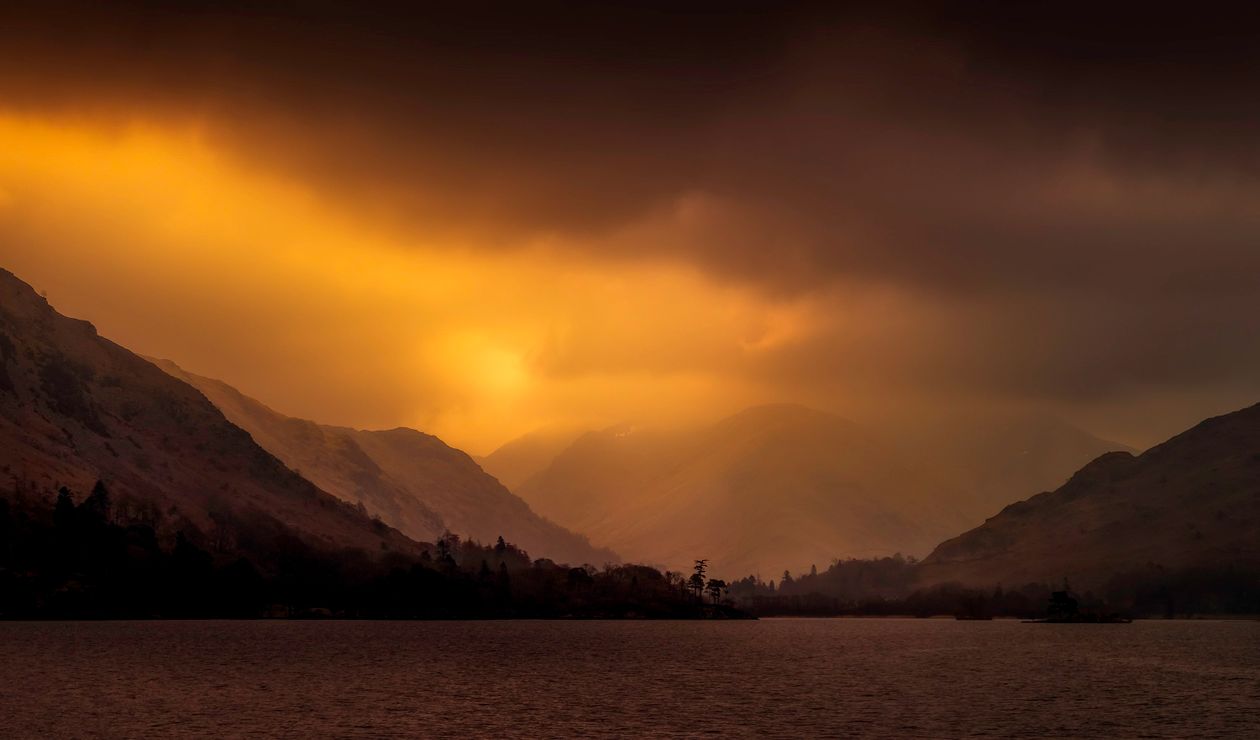Body Of Water Near Mountains During Golden Hour · Free Stock Photo