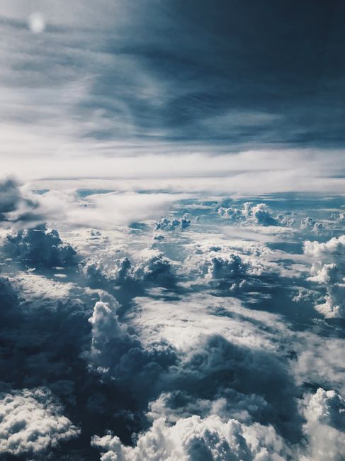 Explore the breathtaking aerial view of a dramatic sky filled with stunning clouds.