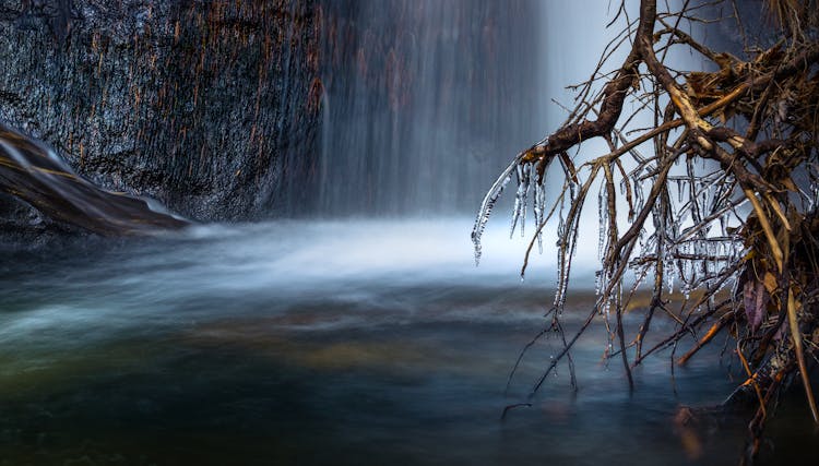 Scenic View Of Waterfall During Winter