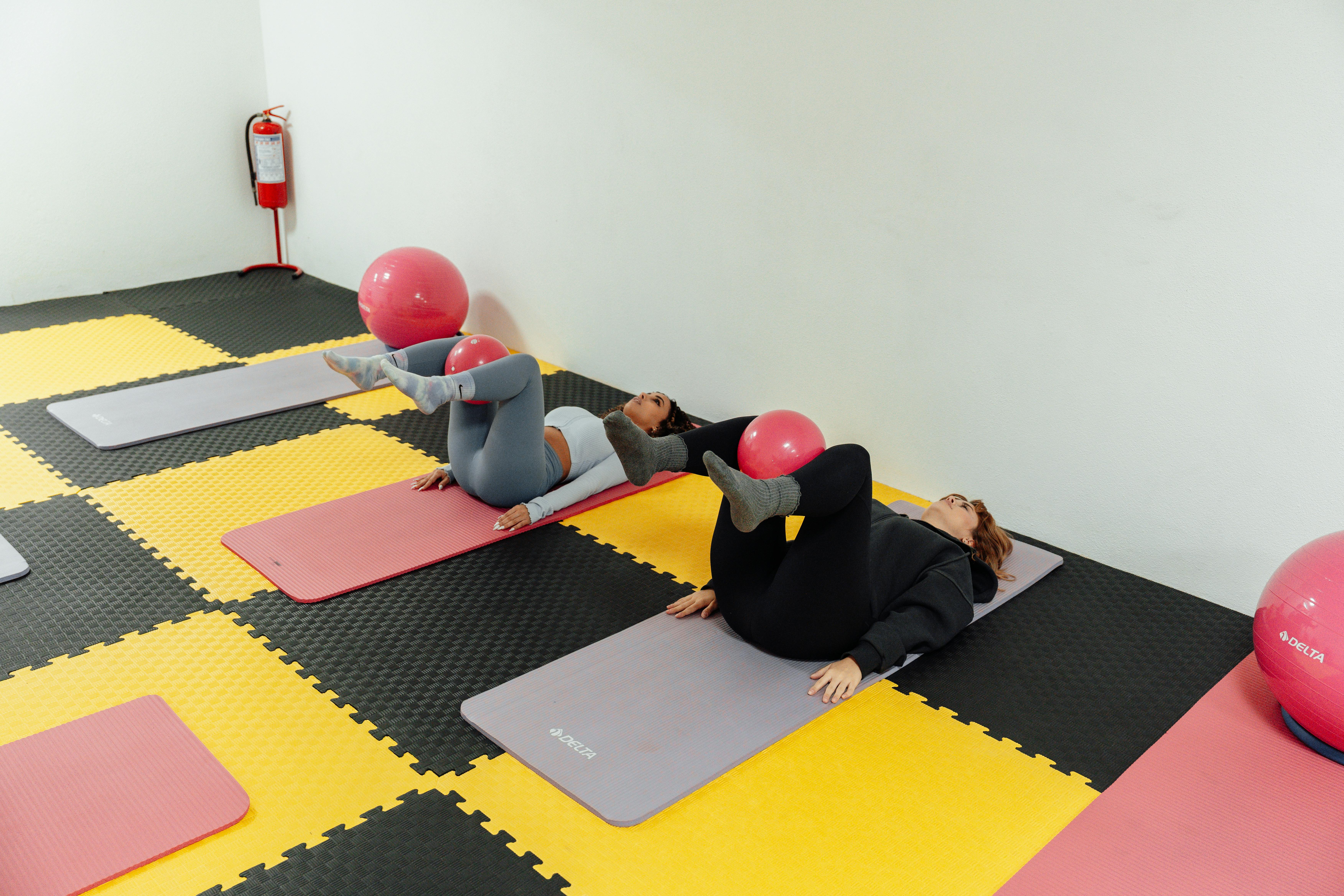 A group of people doing yoga on mats
