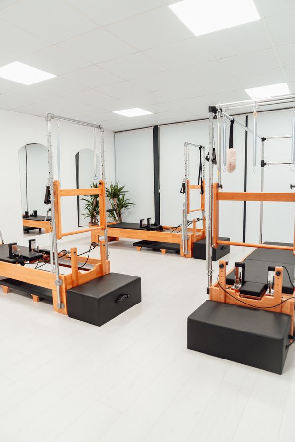 Pilates reformer session, photo by Ahmet Kurt on Pexels