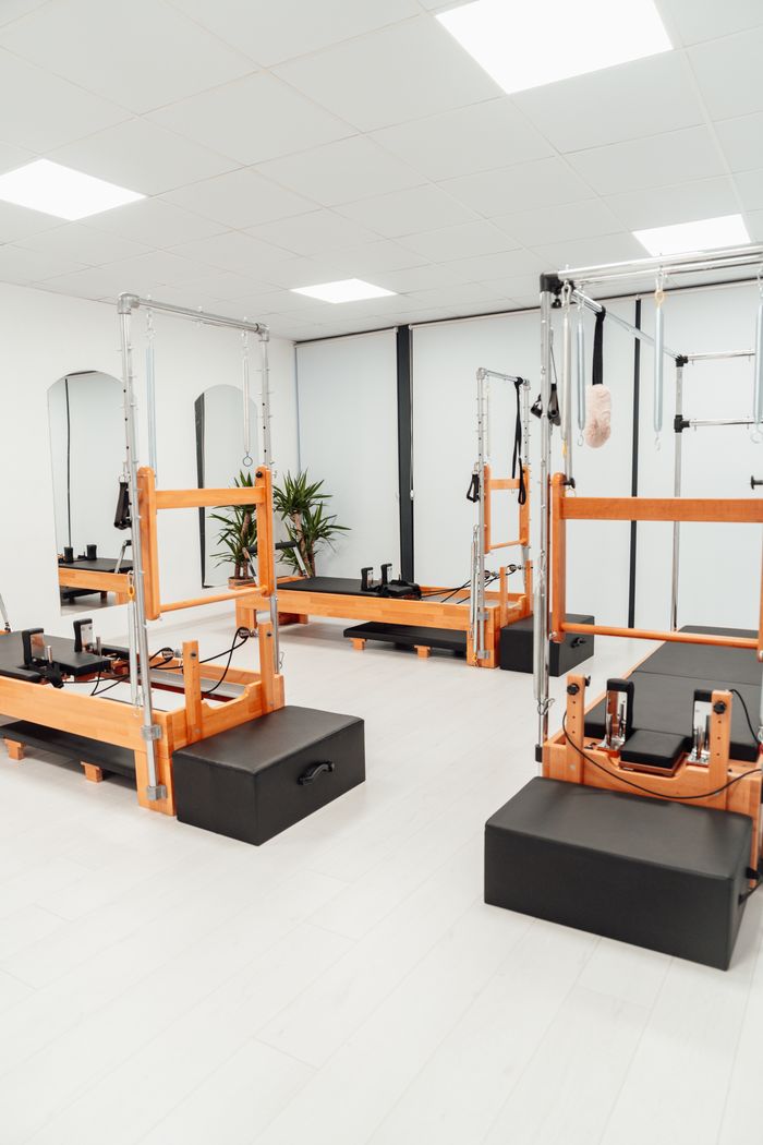 Pilates studio with reformer machines — photo by Ahmet Kurt on Pexels