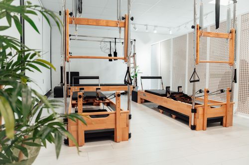 Free Bright and spacious Pilates studio with wooden equipment in a white room, Yalova, Türkiye. Stock Photo