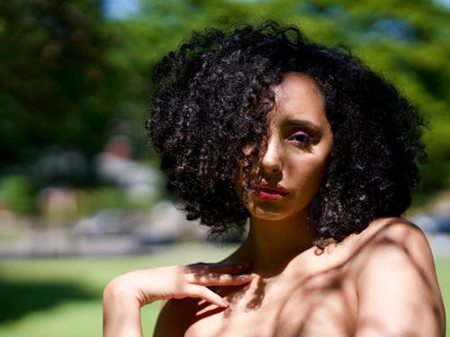 Selective Focus Portrait Photo of Woman Holding Posing