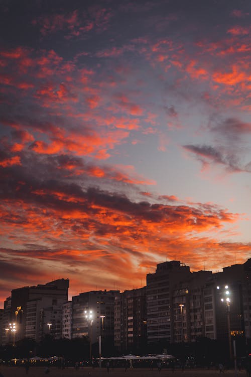 Orange Clouds over City at Sunset · Free Stock Photo