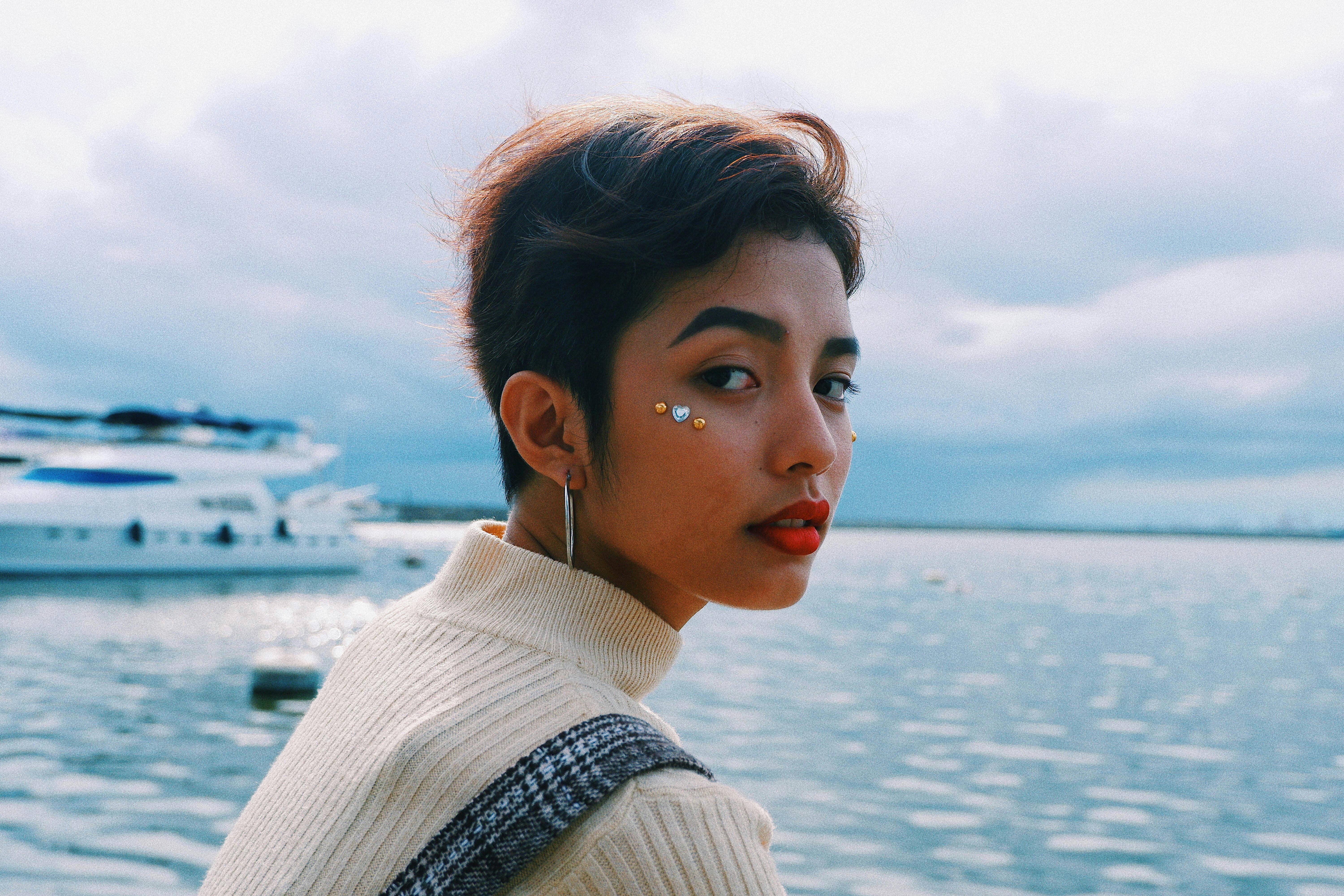 woman with red lipstick at the pier