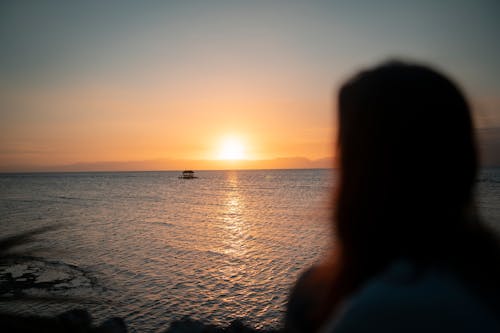 Woman Watching The Sunset