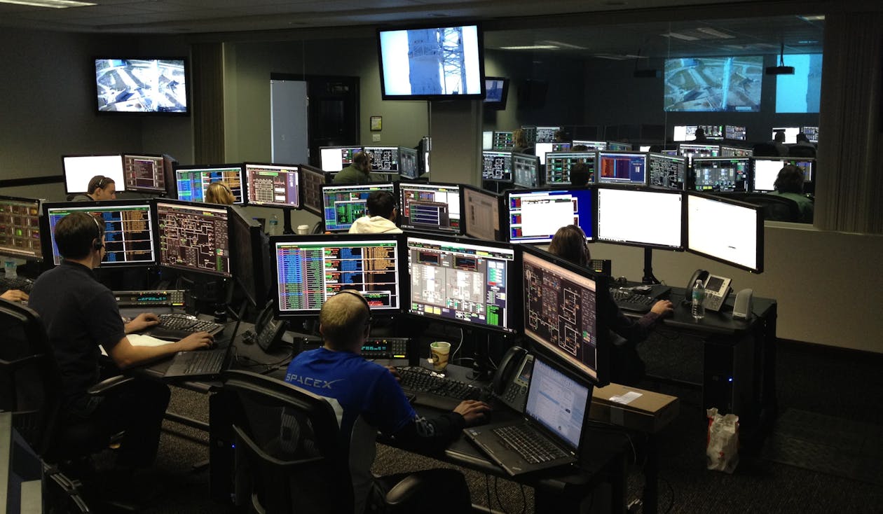 Men Working at Night monitoring virtual assistants