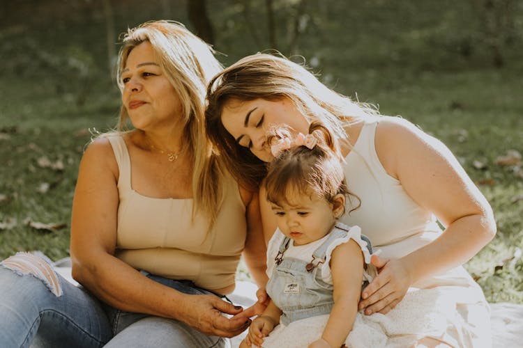 Women Posing With A Baby Girl