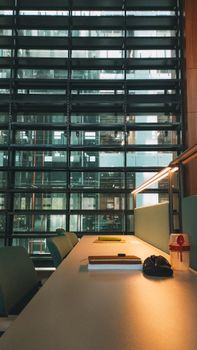 Contemporary office interior with a desk and window view of skyscrapers in İstanbul, Türkiye.