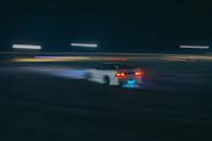 Nissan Car Racing at Circuit at Night