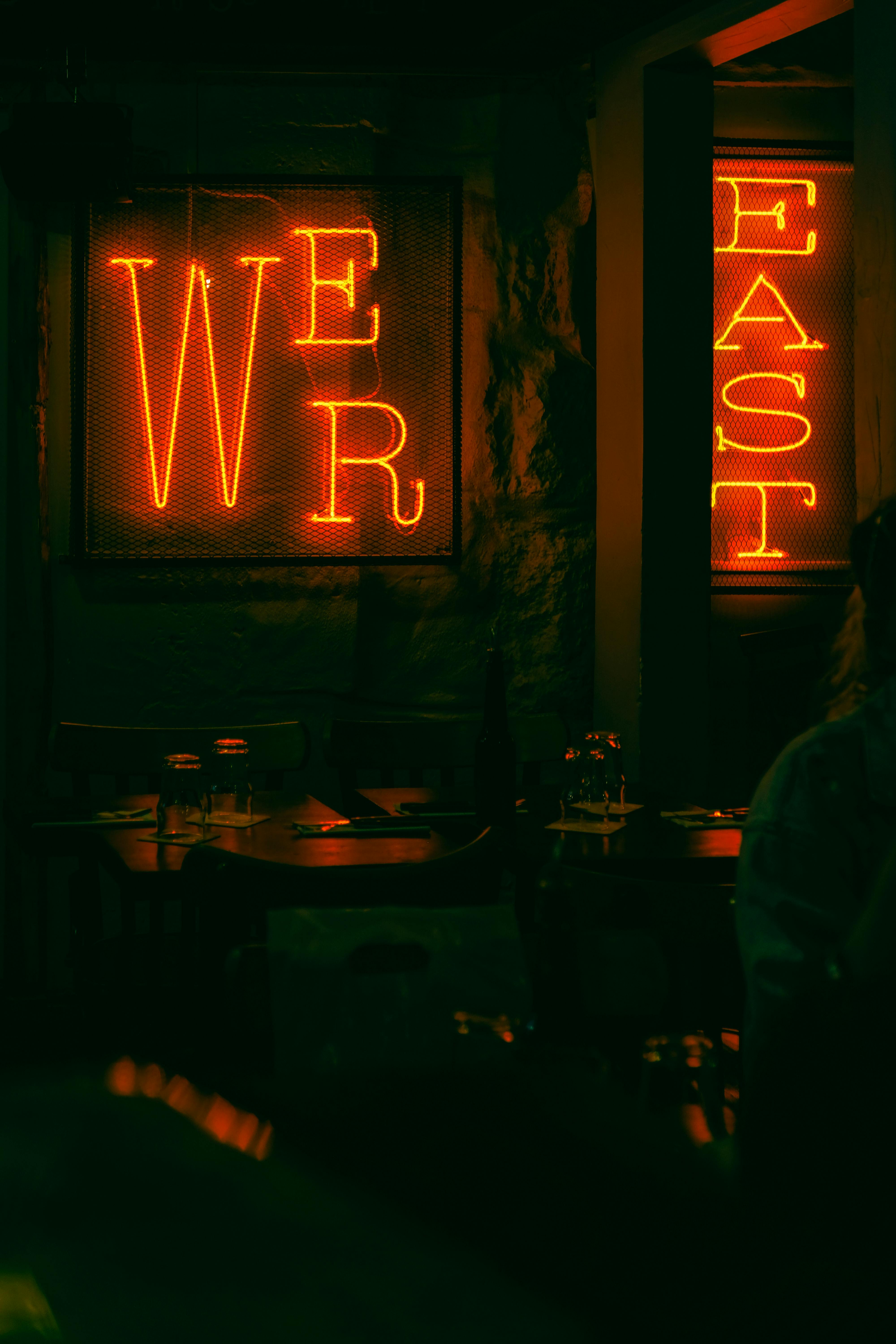 person standing near east signage