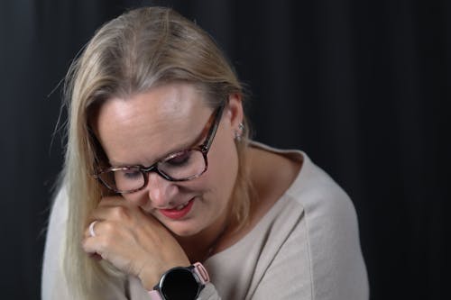 Smiling Blonde Woman in Eyeglasses