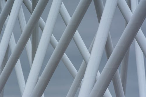 A close up of a metal structure with white lines