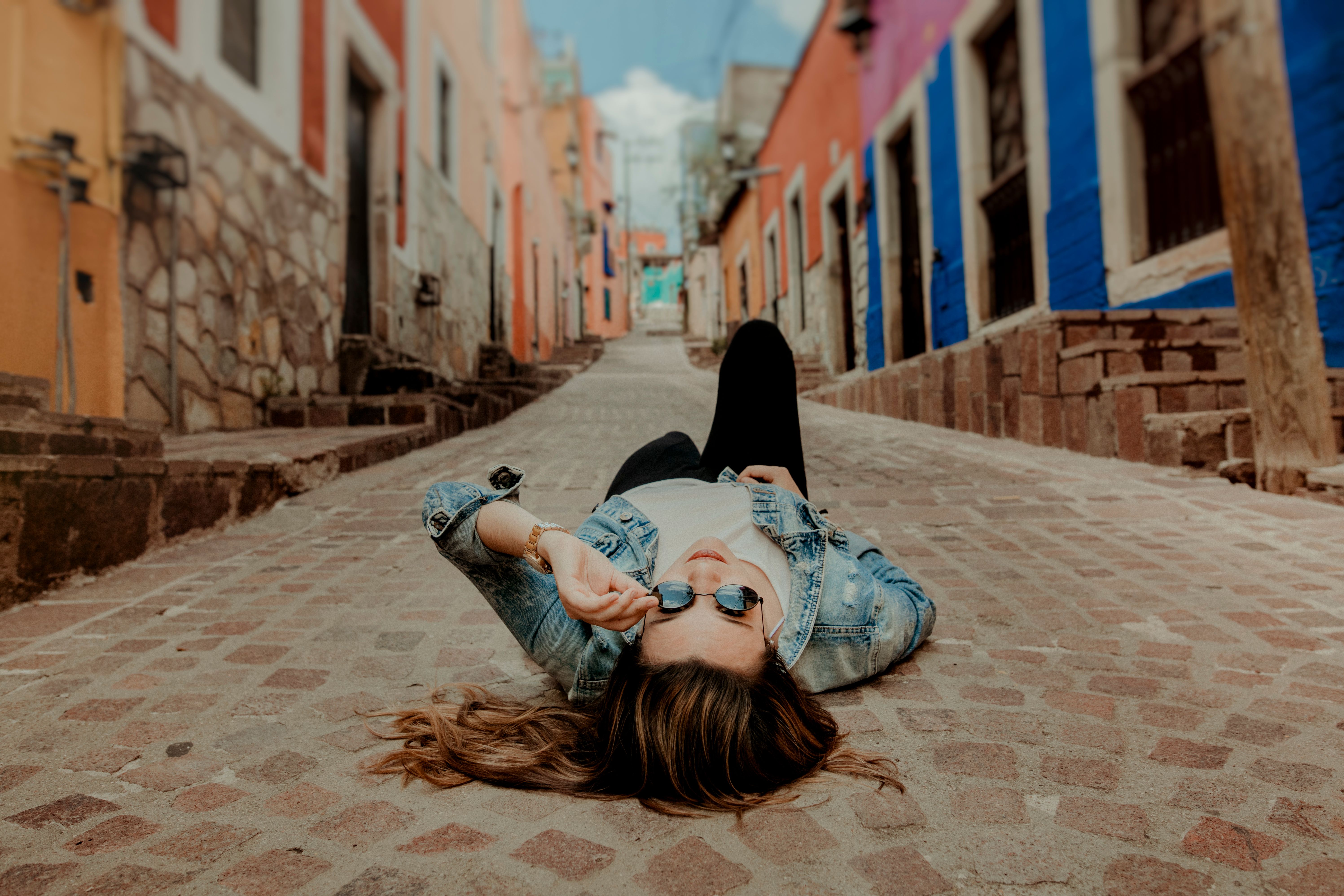 Woman Lying on the Road · Free Stock Photo
