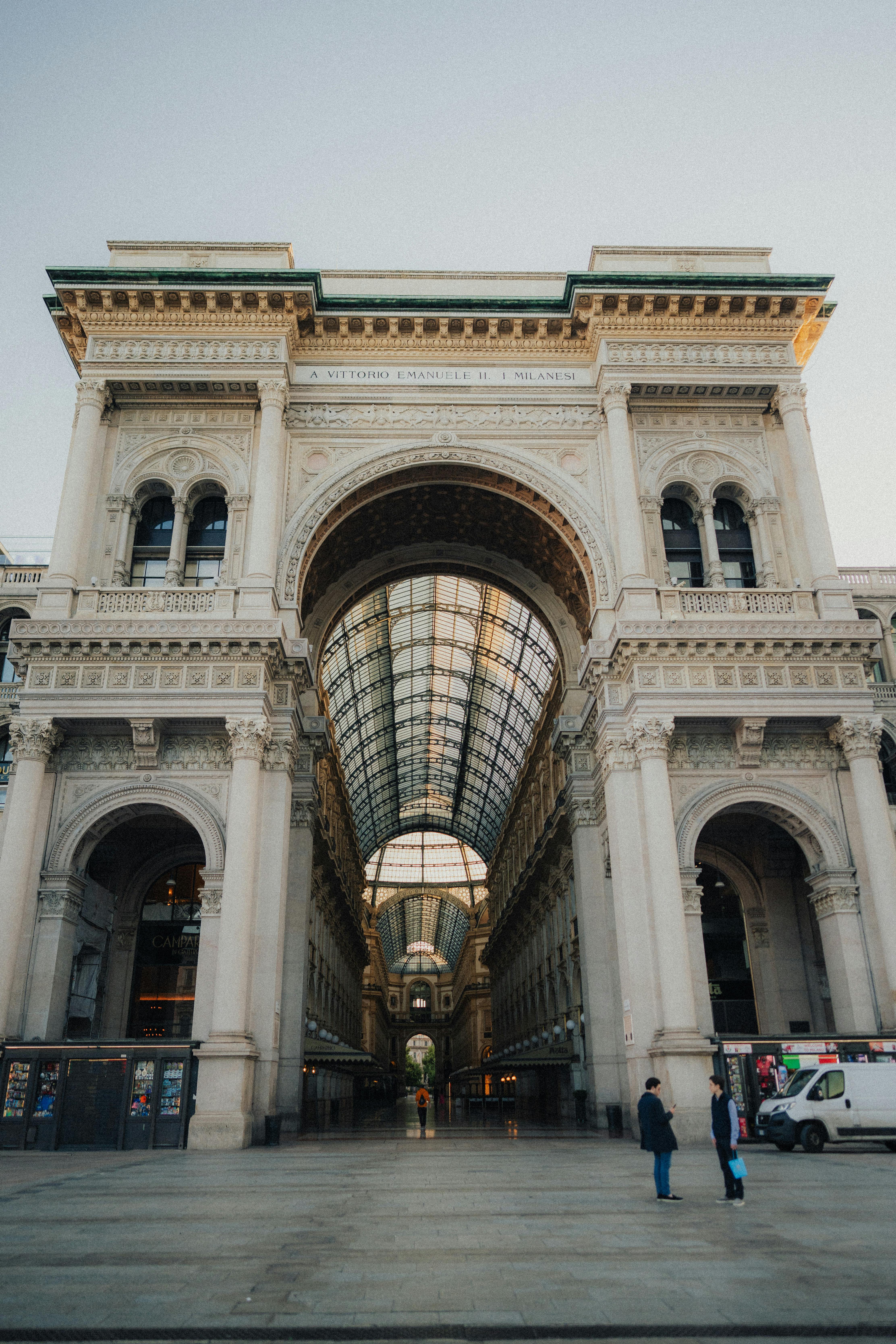 Iconic Galleria Vittorio Emanuele II's grand entrance in Milan, Italy, showcasing its stunning architecture.