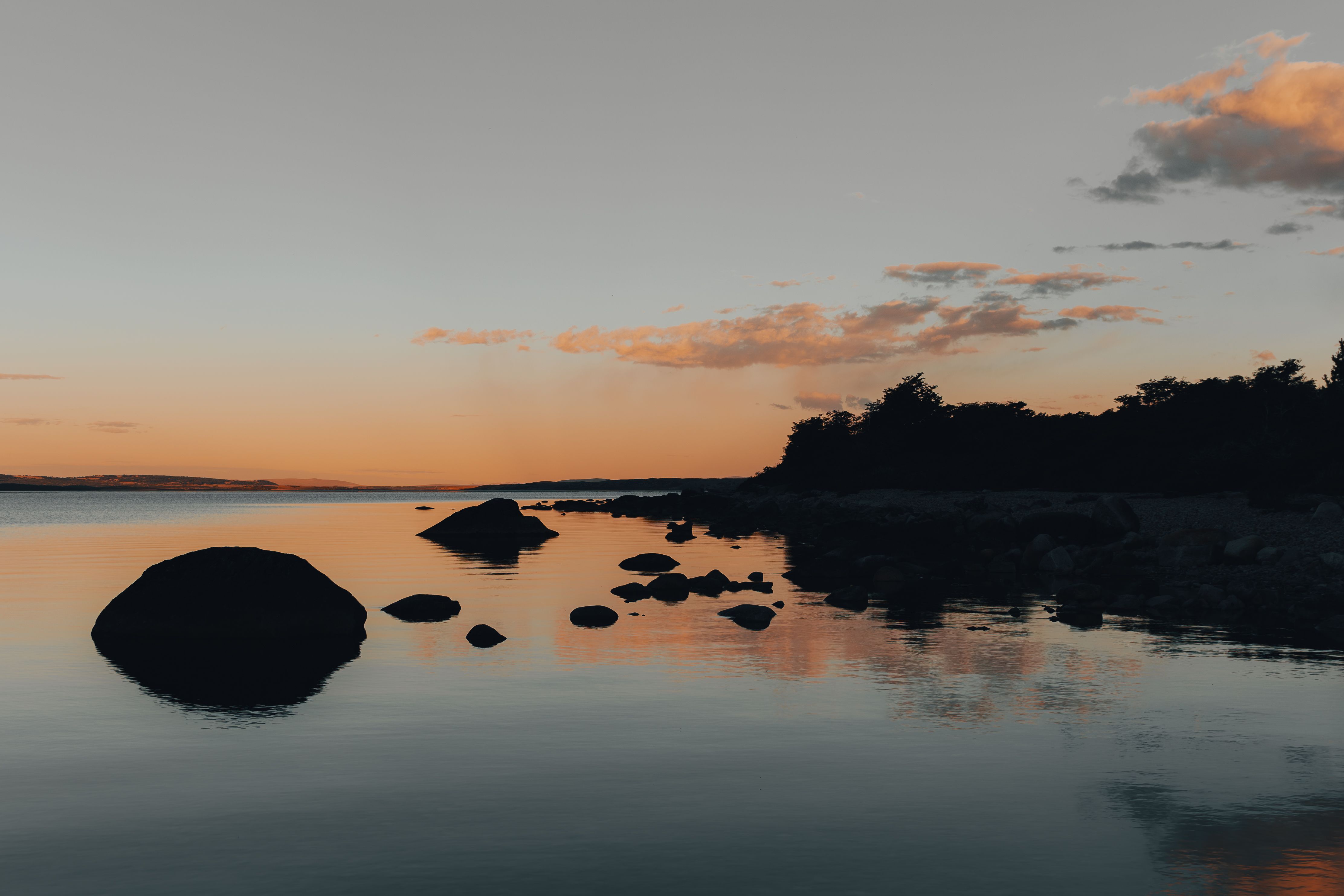 Rocks on Calm Lake at Sunset · Free Stock Photo