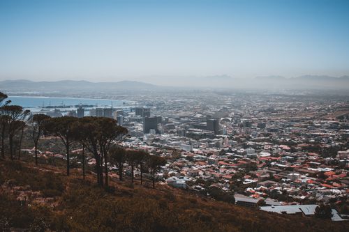 Free A stunning aerial view of Cape Town showcasing the cityscape and coastal beauty under a clear sky. Stock Photo